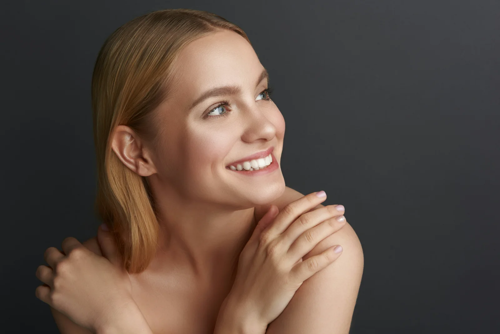 Smiling woman with bright, white teeth