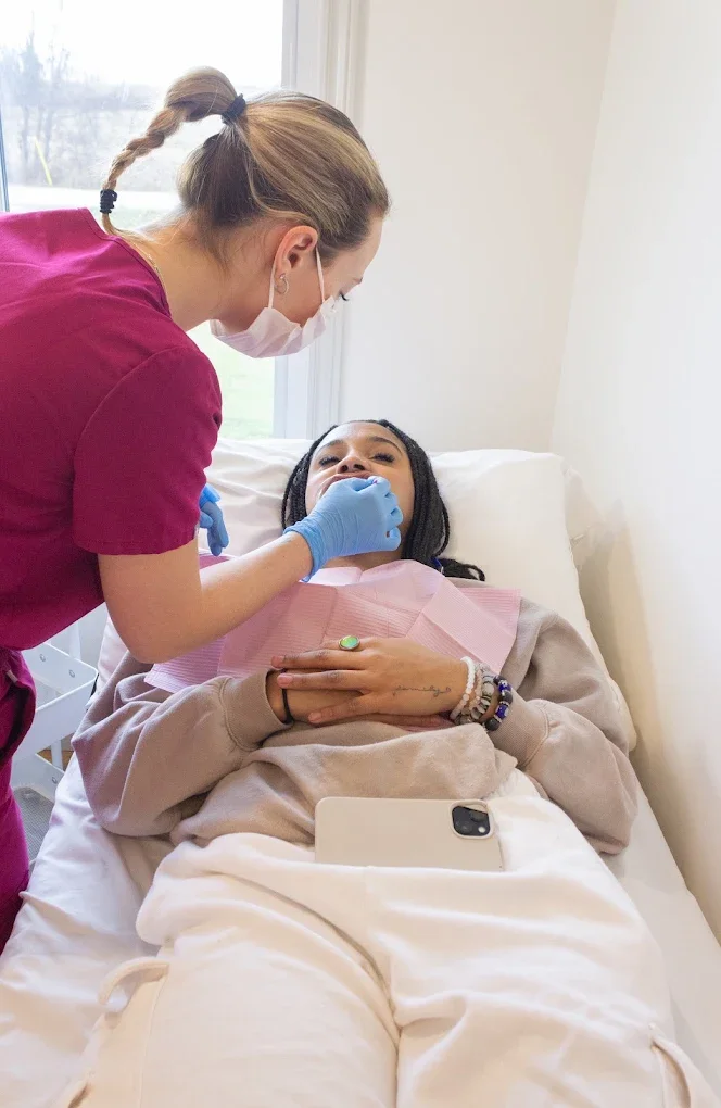 Technician and client during a Boost Whitening appointment