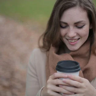 Woman holding a cup of coffee